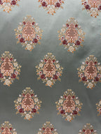 Decorative pattern with floral damask motif medallion elements on a Teal Blue background