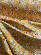 Floral pattern with green leaves and white flowers on Orange background
