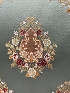 Decorative pattern with floral damask motif medallion elements on a Teal Blue background