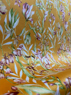 Floral pattern with green leaves and white flowers on Orange background