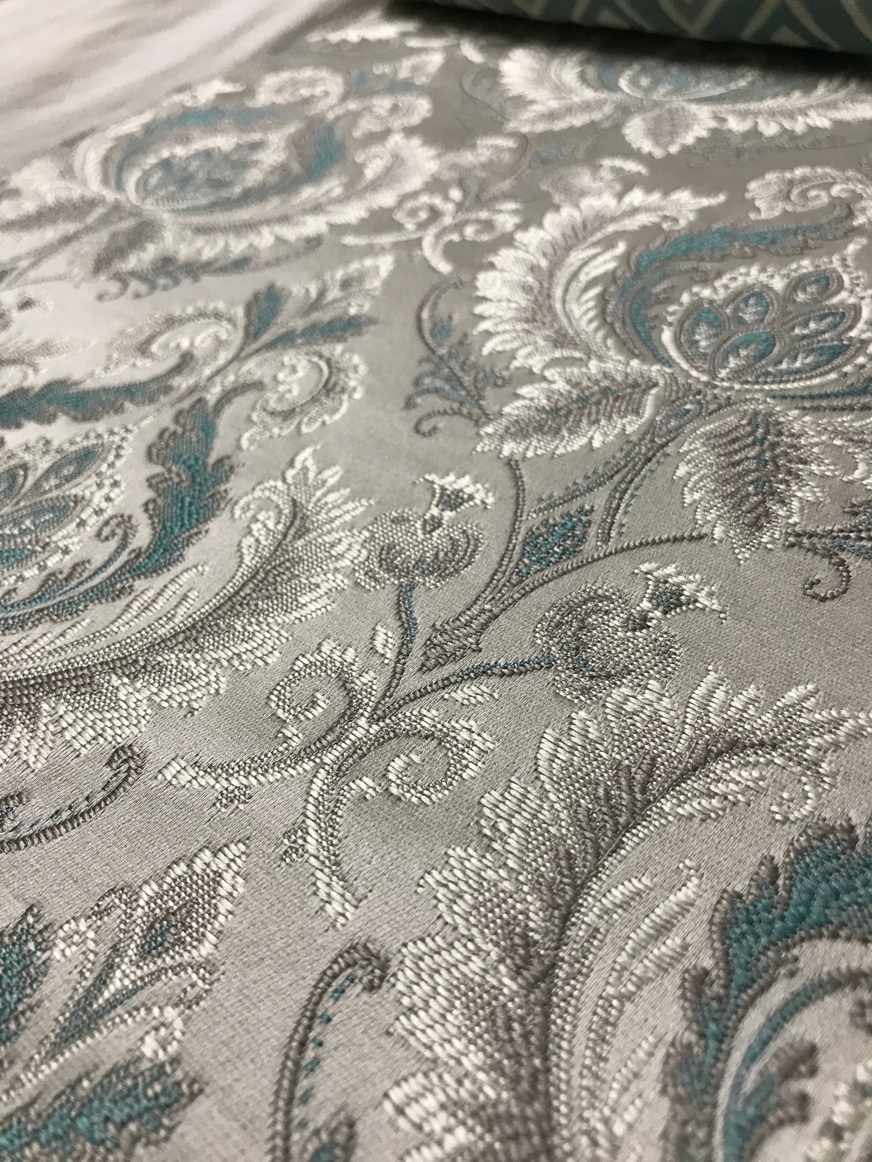 Sapphire blue damask fabric swatch showing repeat pattern detail