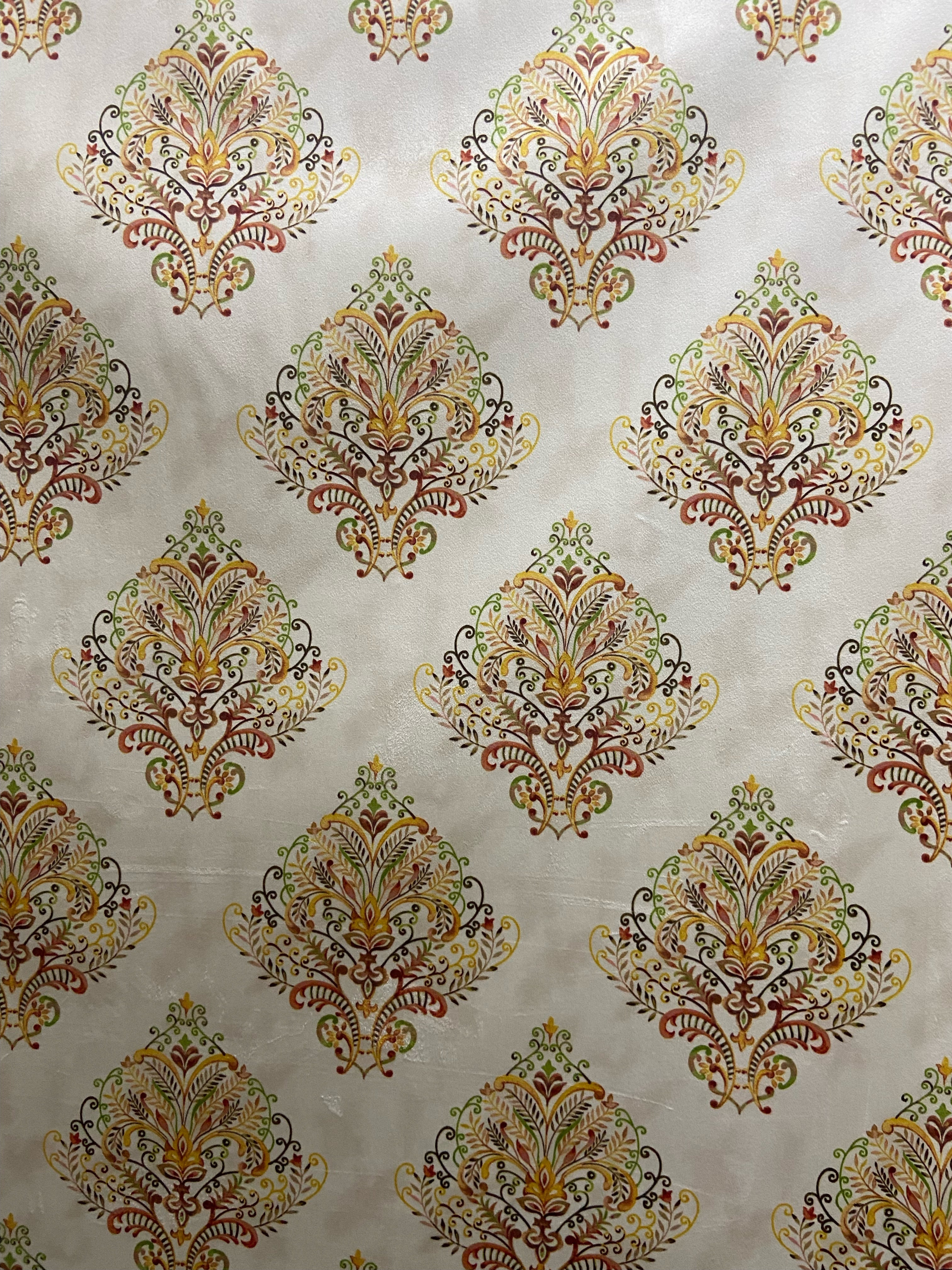 Decorative fabric pattern with Orange designs on a taupe background