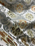 Decorative fabric with intricate Rust floral pattern on a beige background