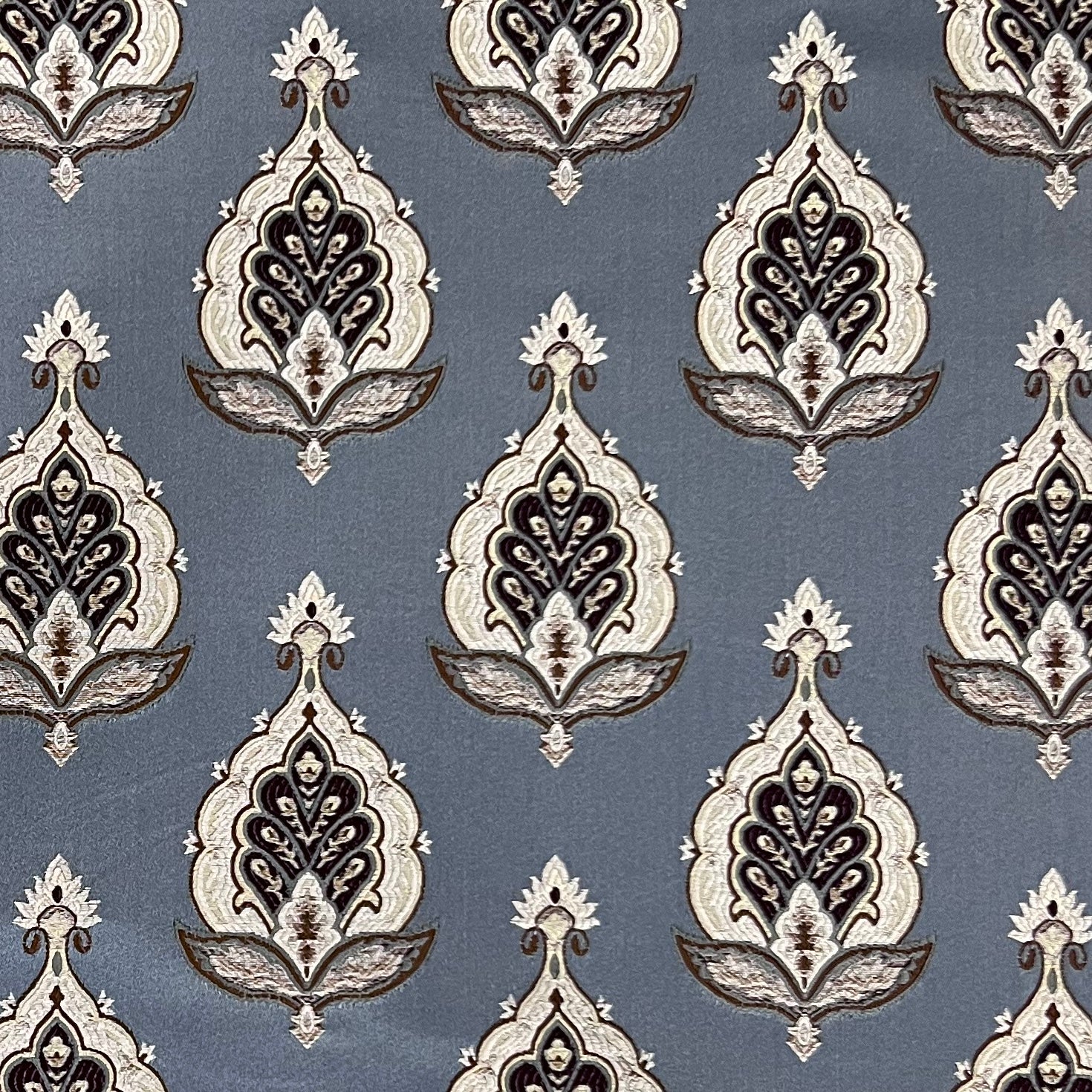 Patterned fabric with decorative Medallion Motif design on a Blue background