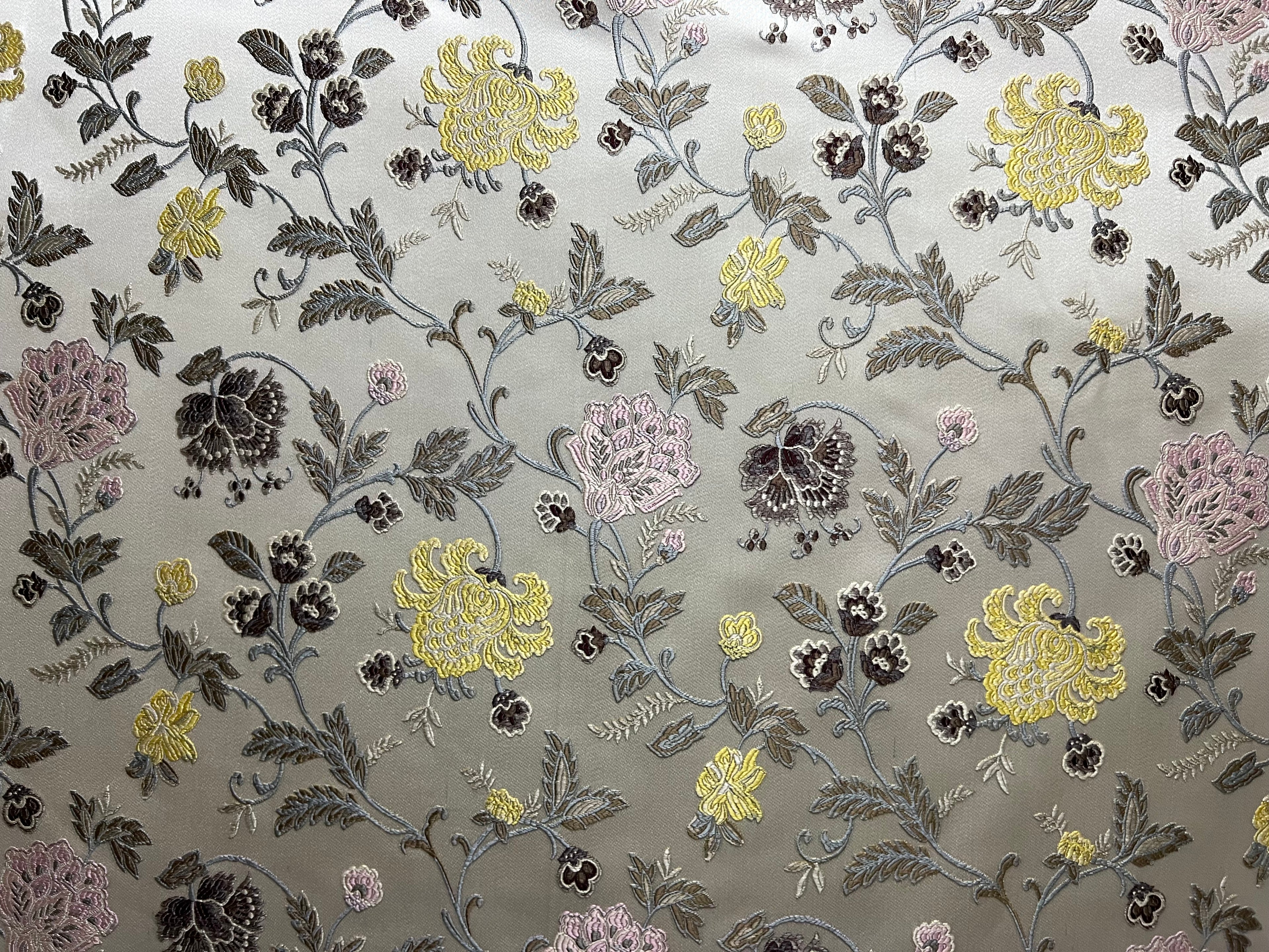 Embroidered Yellow floral pattern on fabric