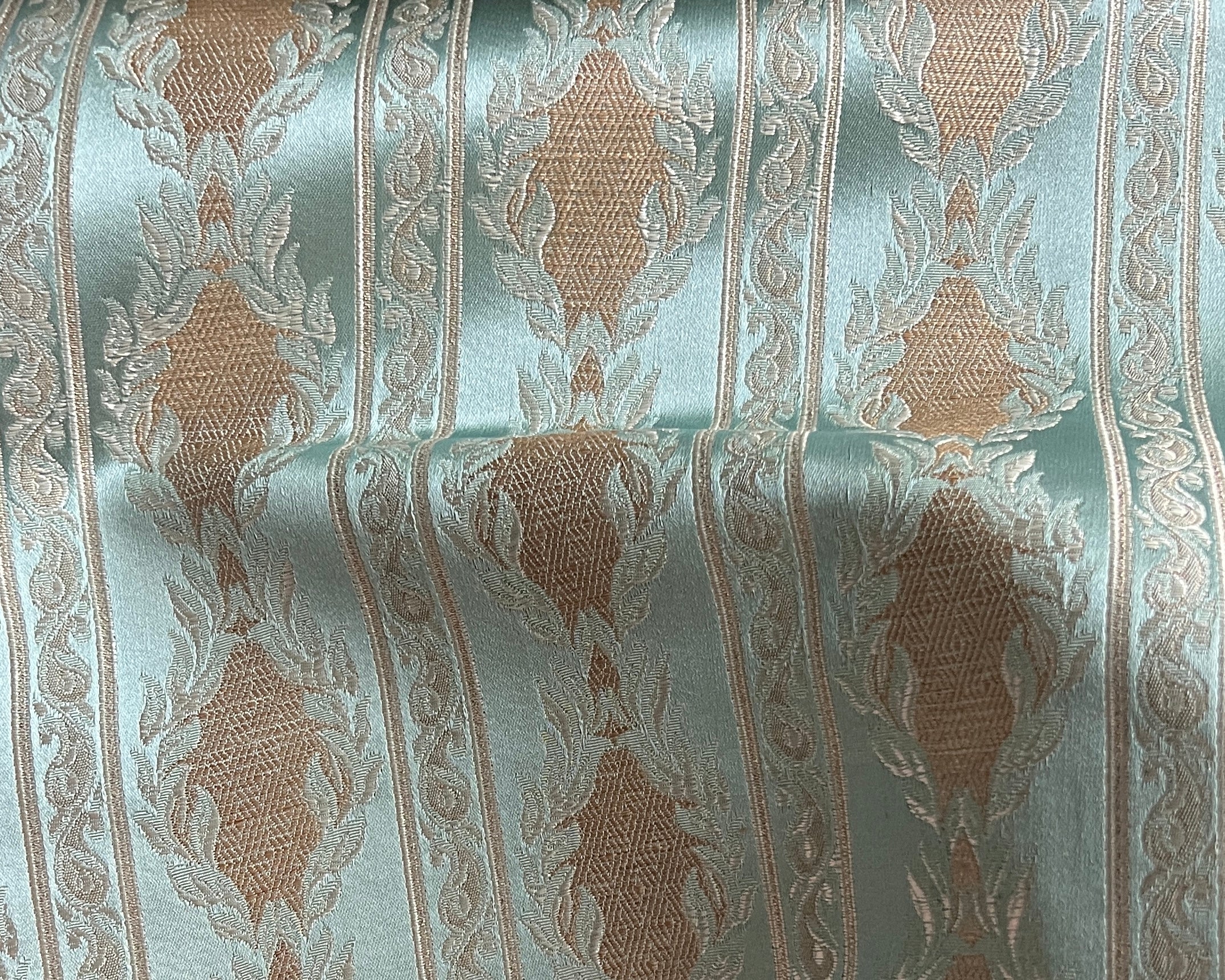 Decorative fabric with a stripe pattern on a Pista background