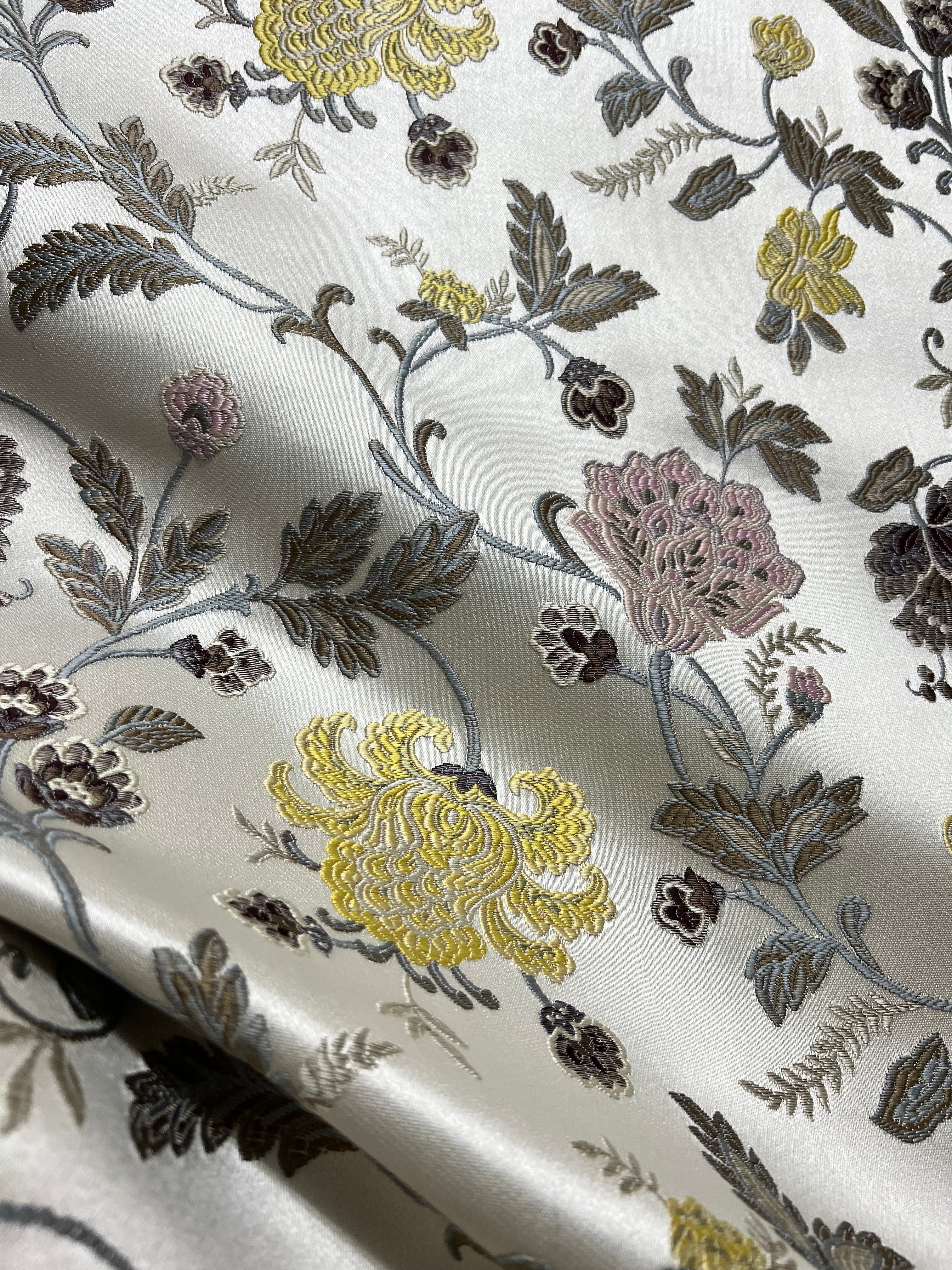 Embroidered Yellow floral pattern on fabric