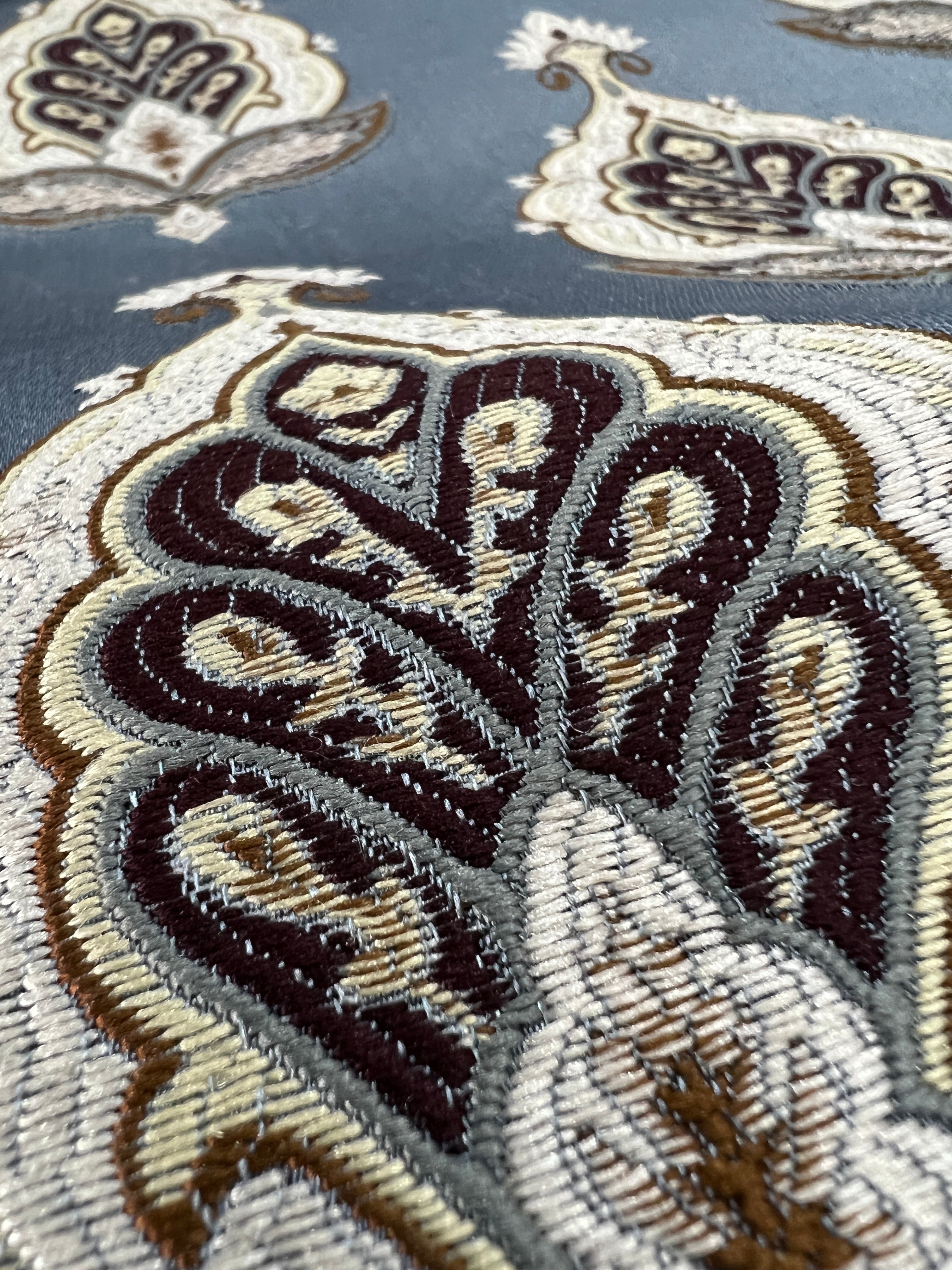 Patterned fabric with decorative Medallion Motif design on a Blue background
