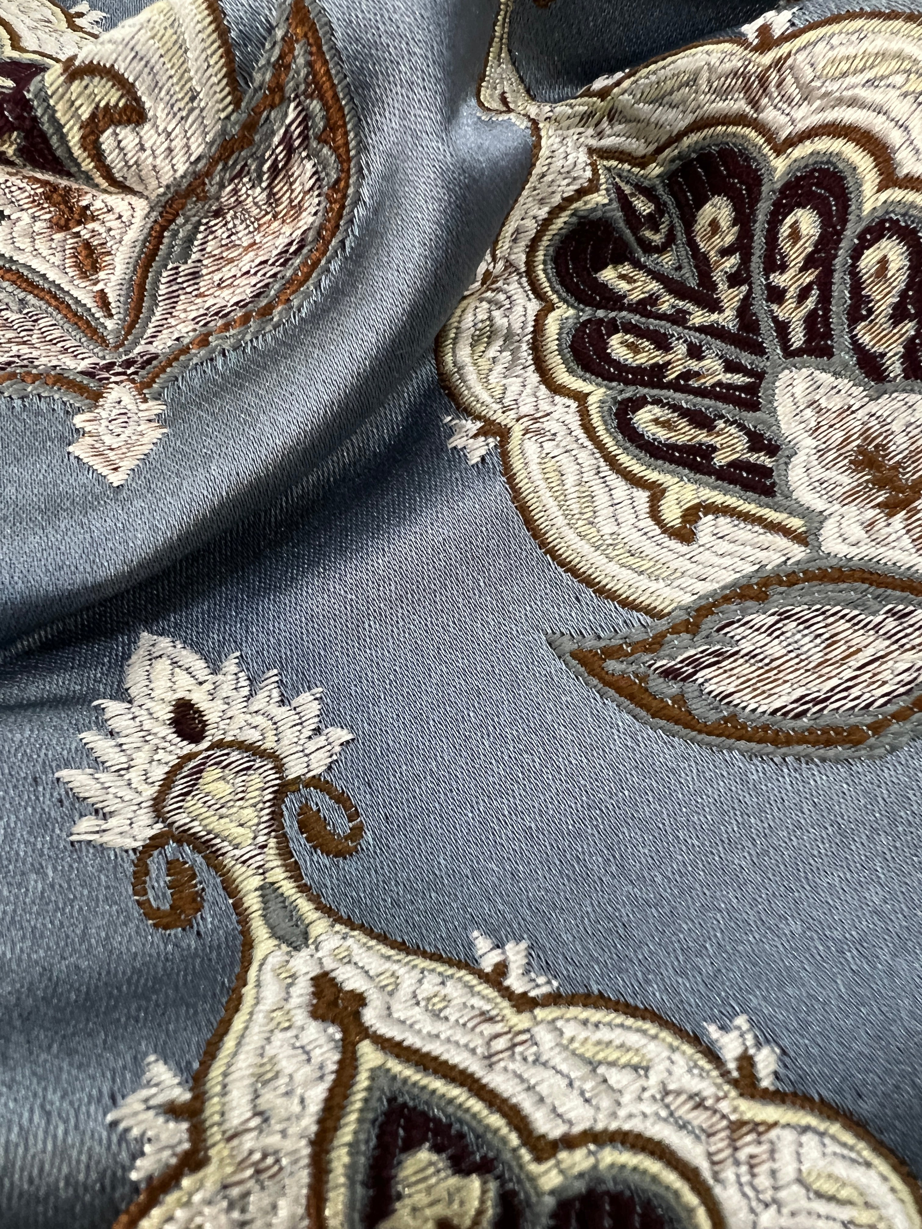 Patterned fabric with decorative Medallion Motif design on a Blue background