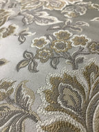 Gold floral jacquard fabric swatch showing repeat pattern detail.