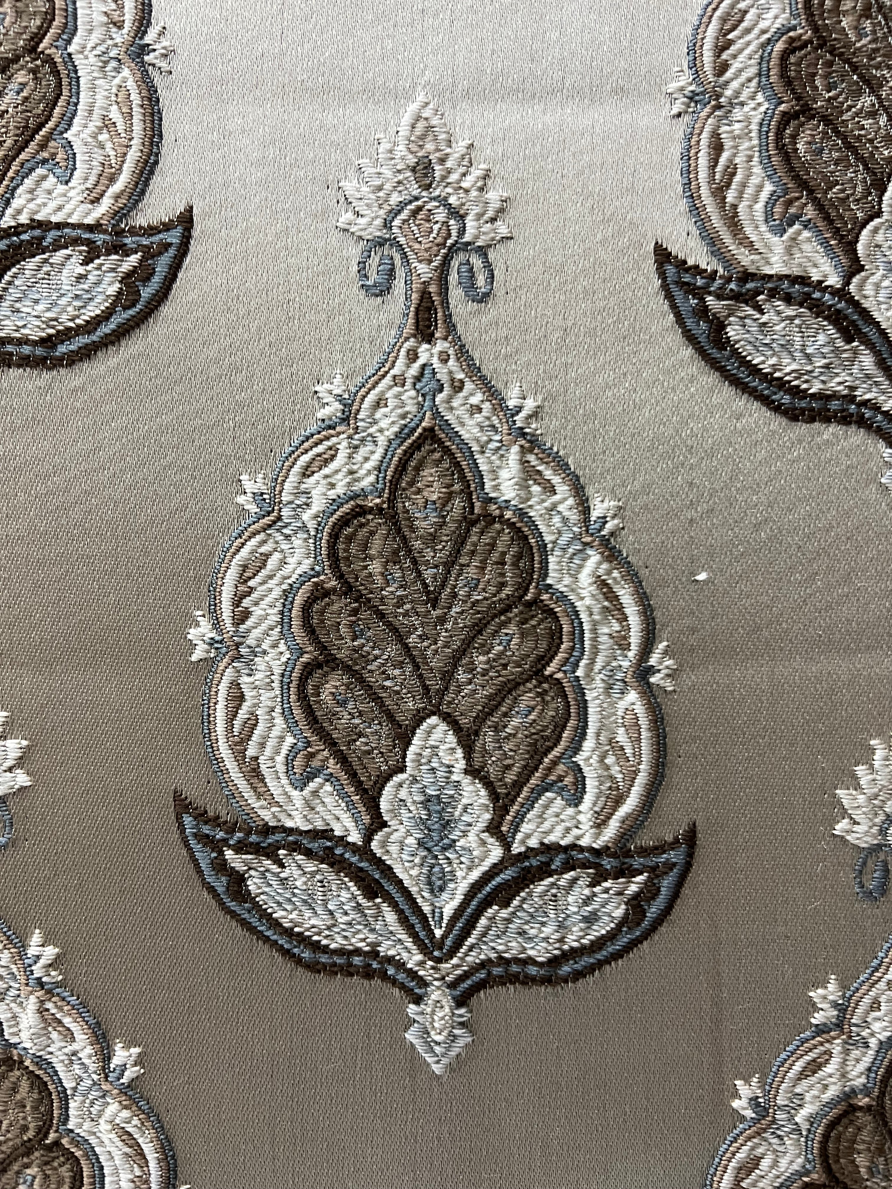 Patterned fabric with decorative Medallion Motif design on a Beige background