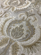 Gold damask fabric swatch showing repeat pattern detail