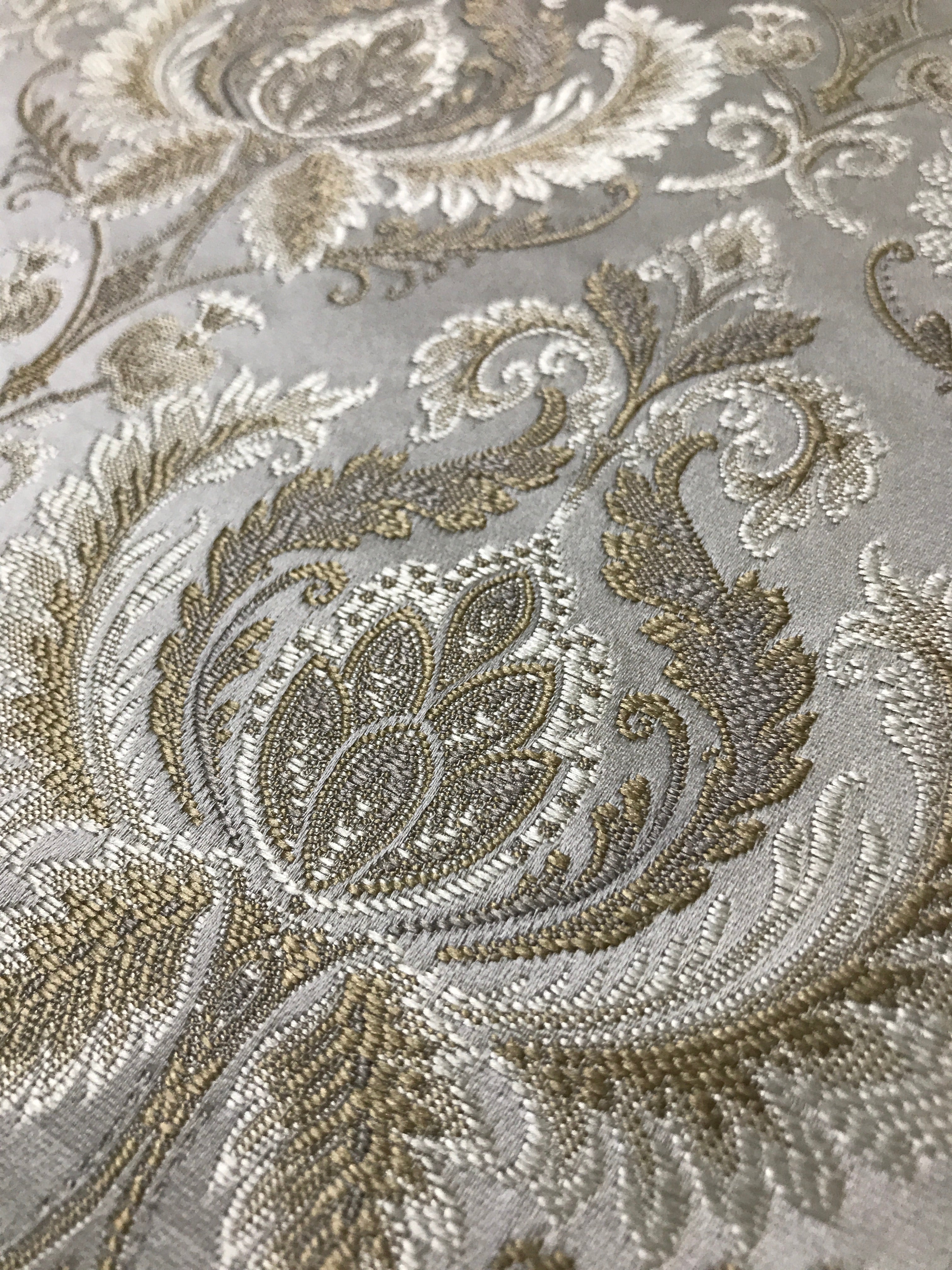 Gold damask fabric swatch showing repeat pattern detail