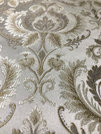 Gold damask fabric folded, texture and sheen close-up