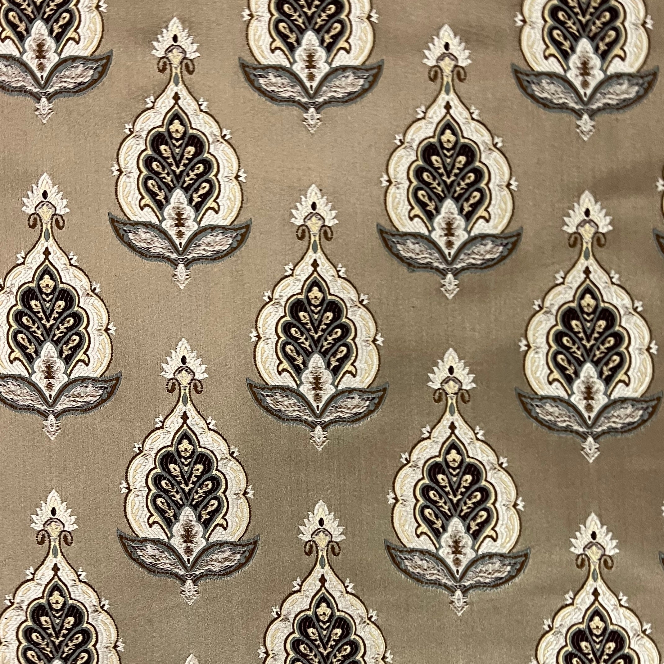 Patterned fabric with decorative Medallion Motif design on a Chocolate background