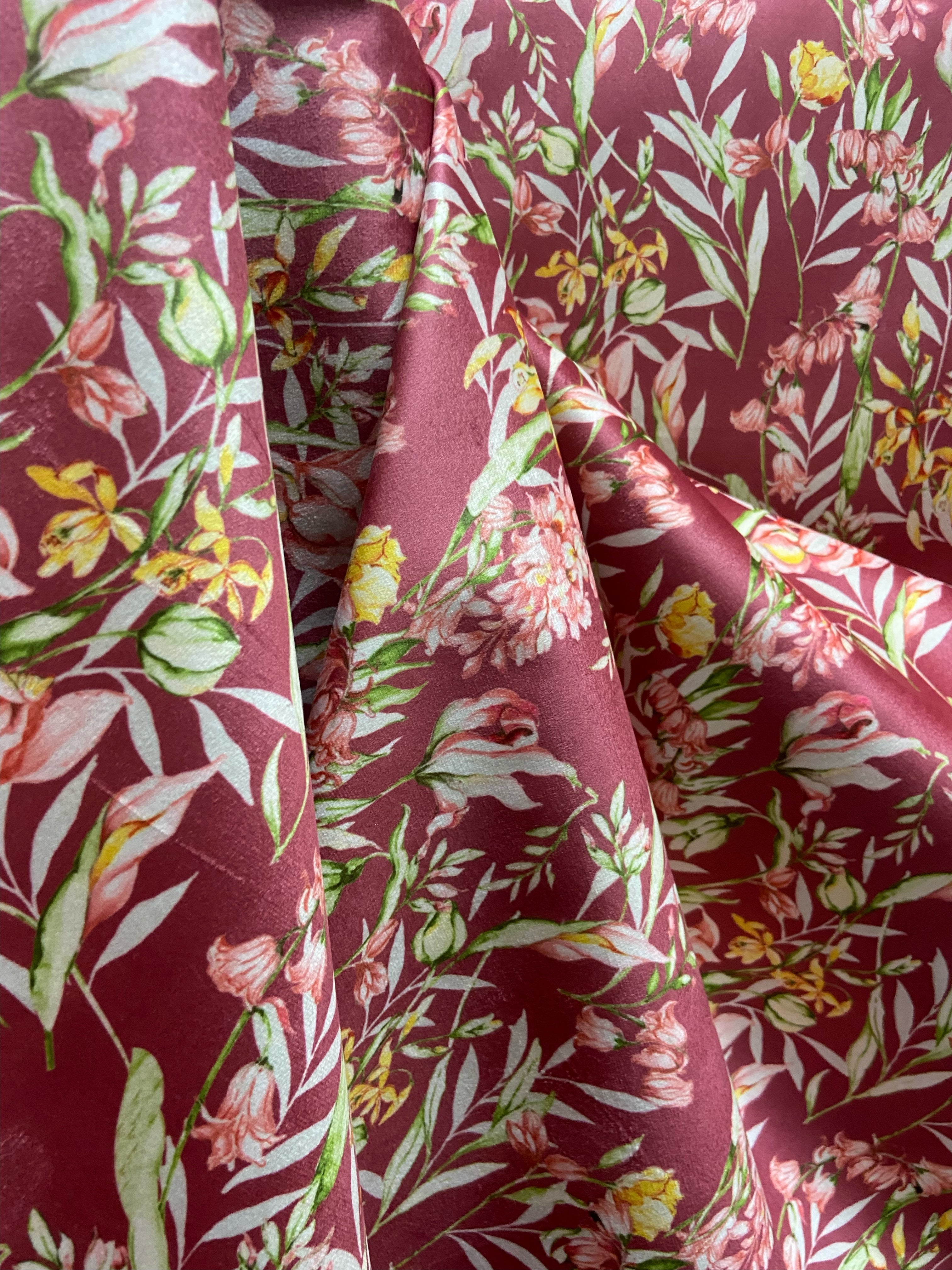 Floral pattern with green leaves and white flowers on Maroon background