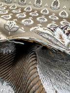 Patterned fabric with decorative Medallion Motif design on a Chocolate background