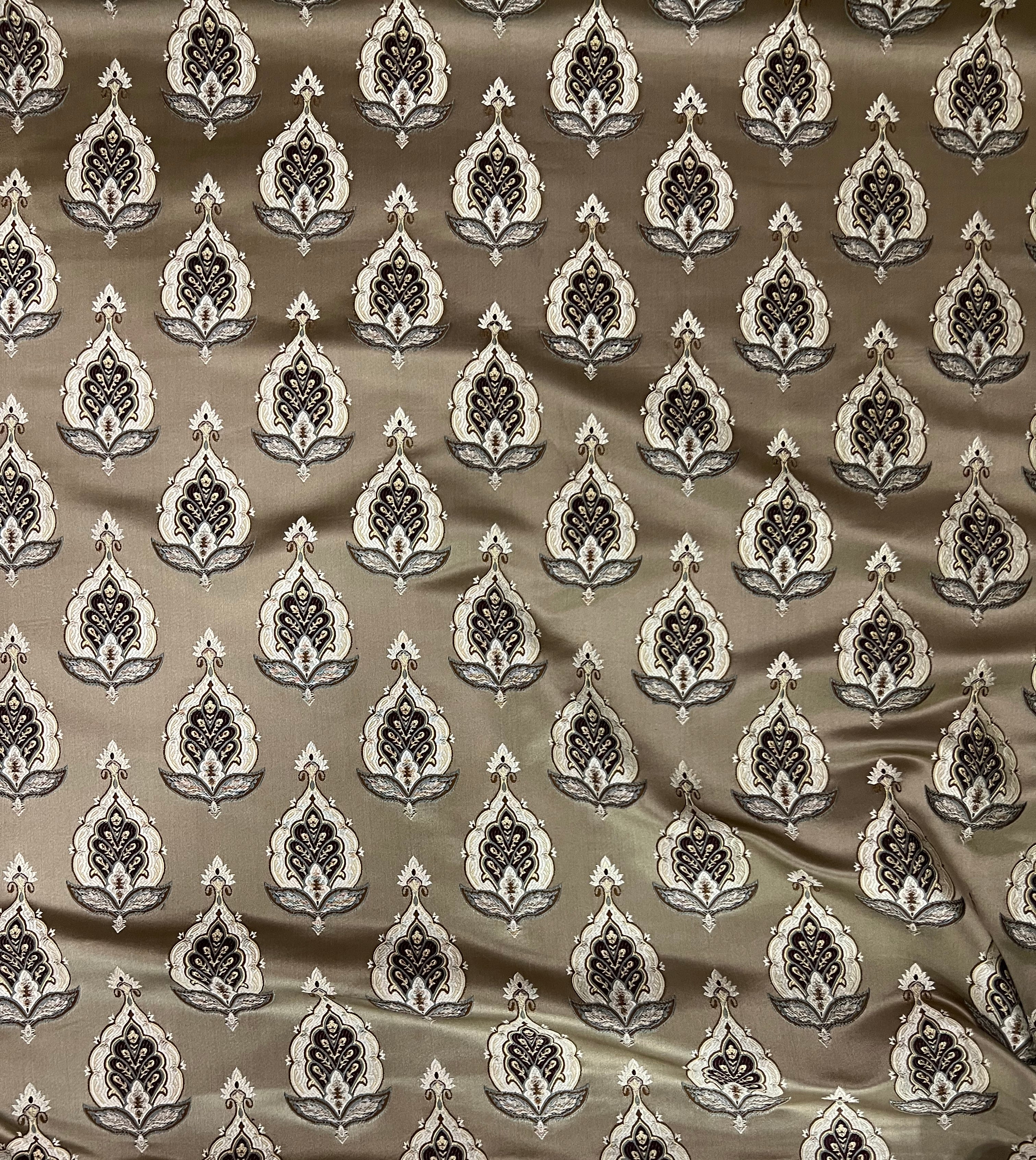 Patterned fabric with decorative Medallion Motif design on a Chocolate background