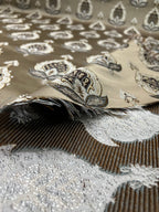 Patterned fabric with decorative Medallion Motif design on a Chocolate background