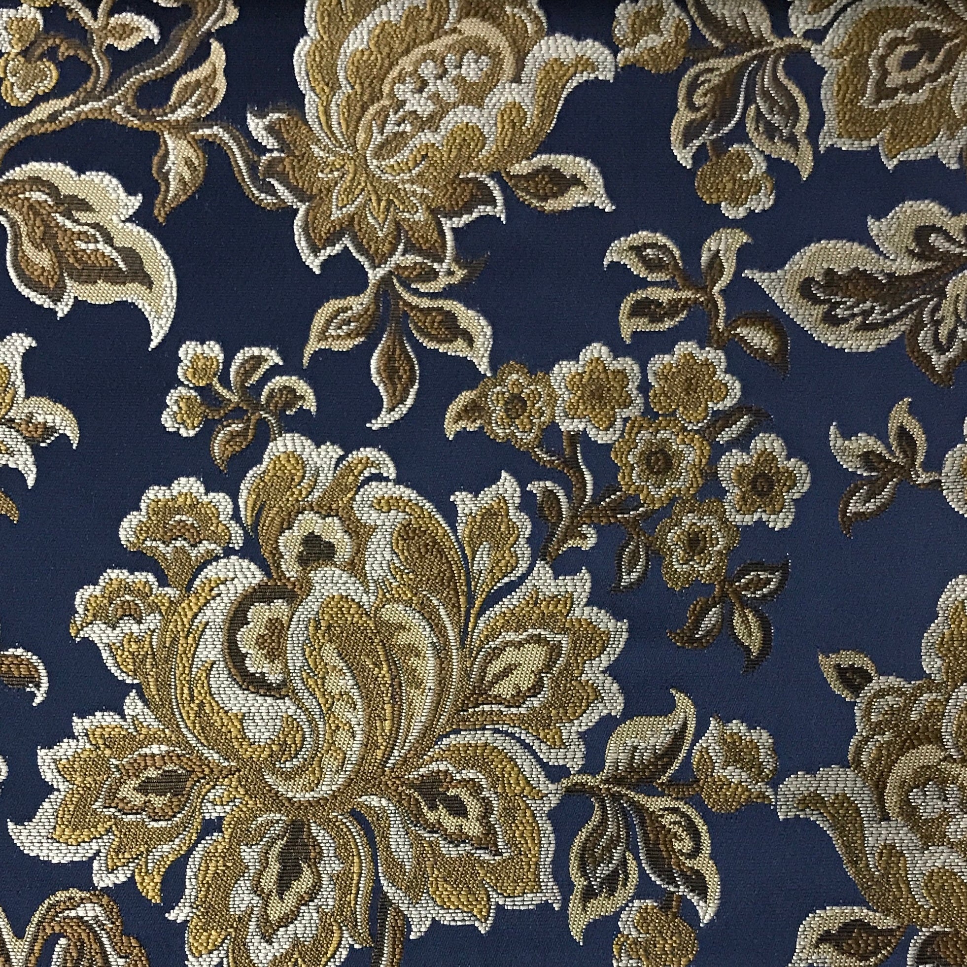 Navy floral jacquard upholstery fabric by the yard, close-up pattern view.