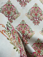 Decorative fabric pattern with Maroon designs on a taupe background