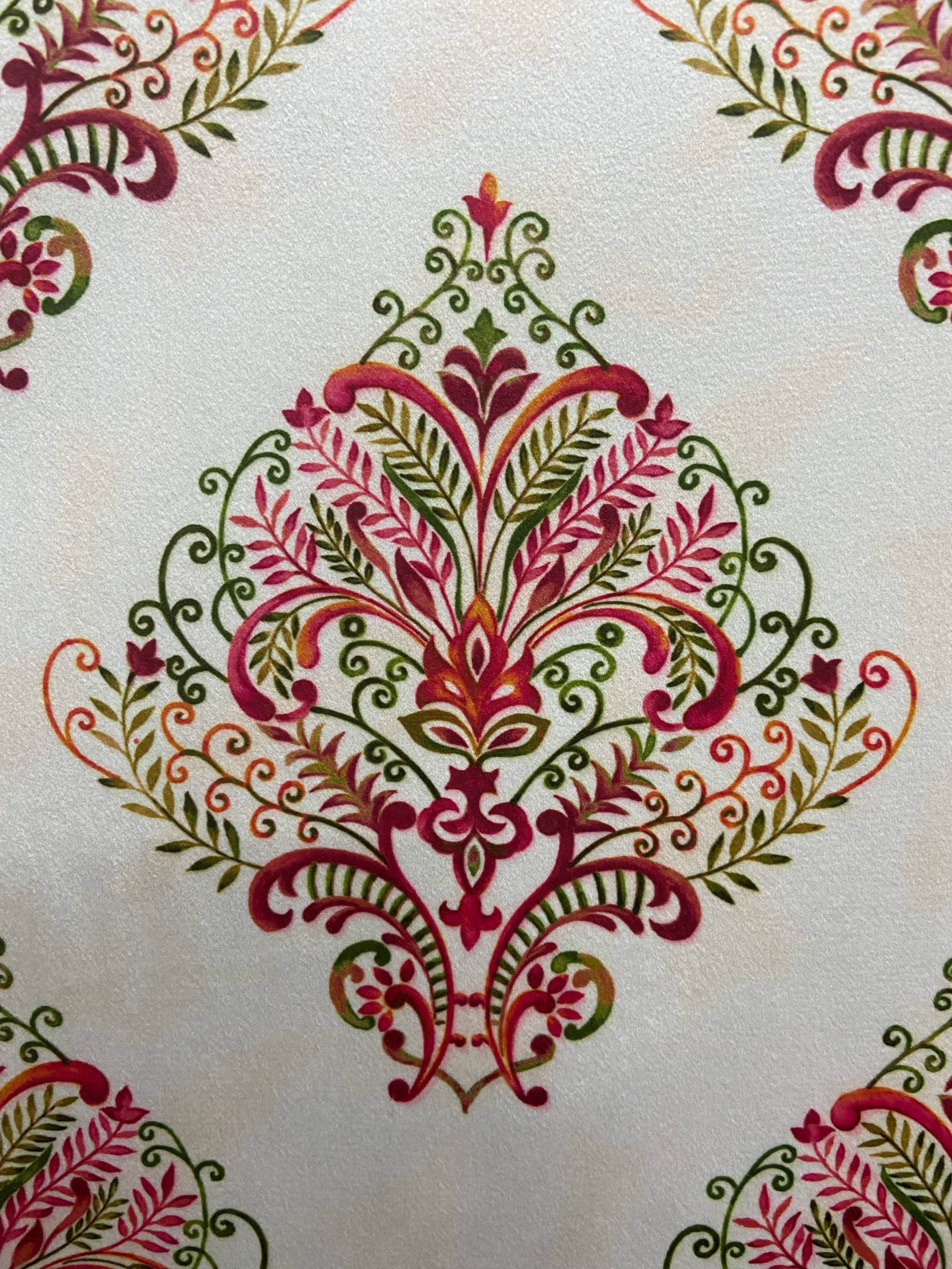 Decorative fabric pattern with Maroon designs on a taupe background