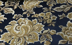 Navy floral jacquard fabric folded, texture close-up.