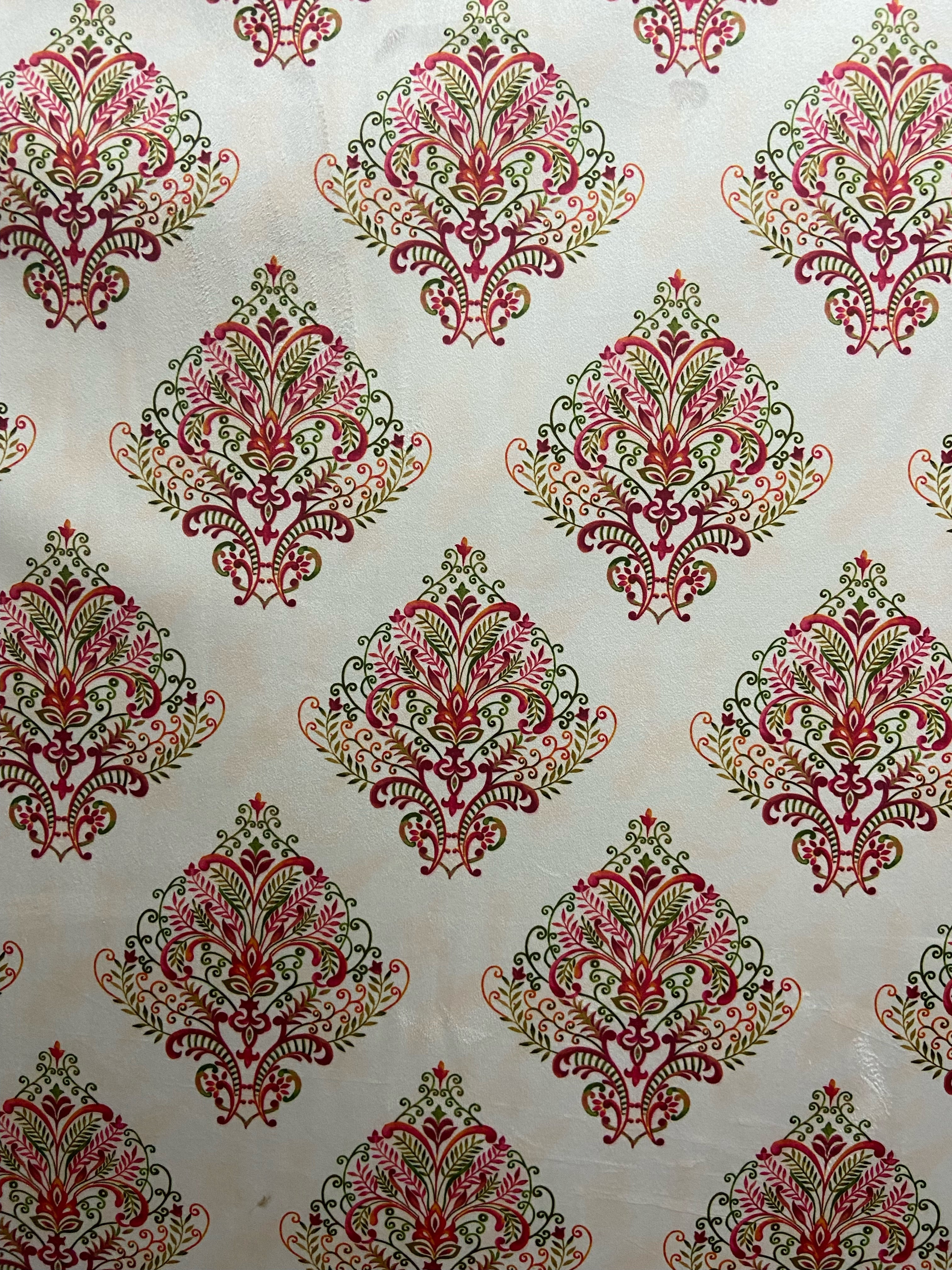 Decorative fabric pattern with Maroon designs on a taupe background
