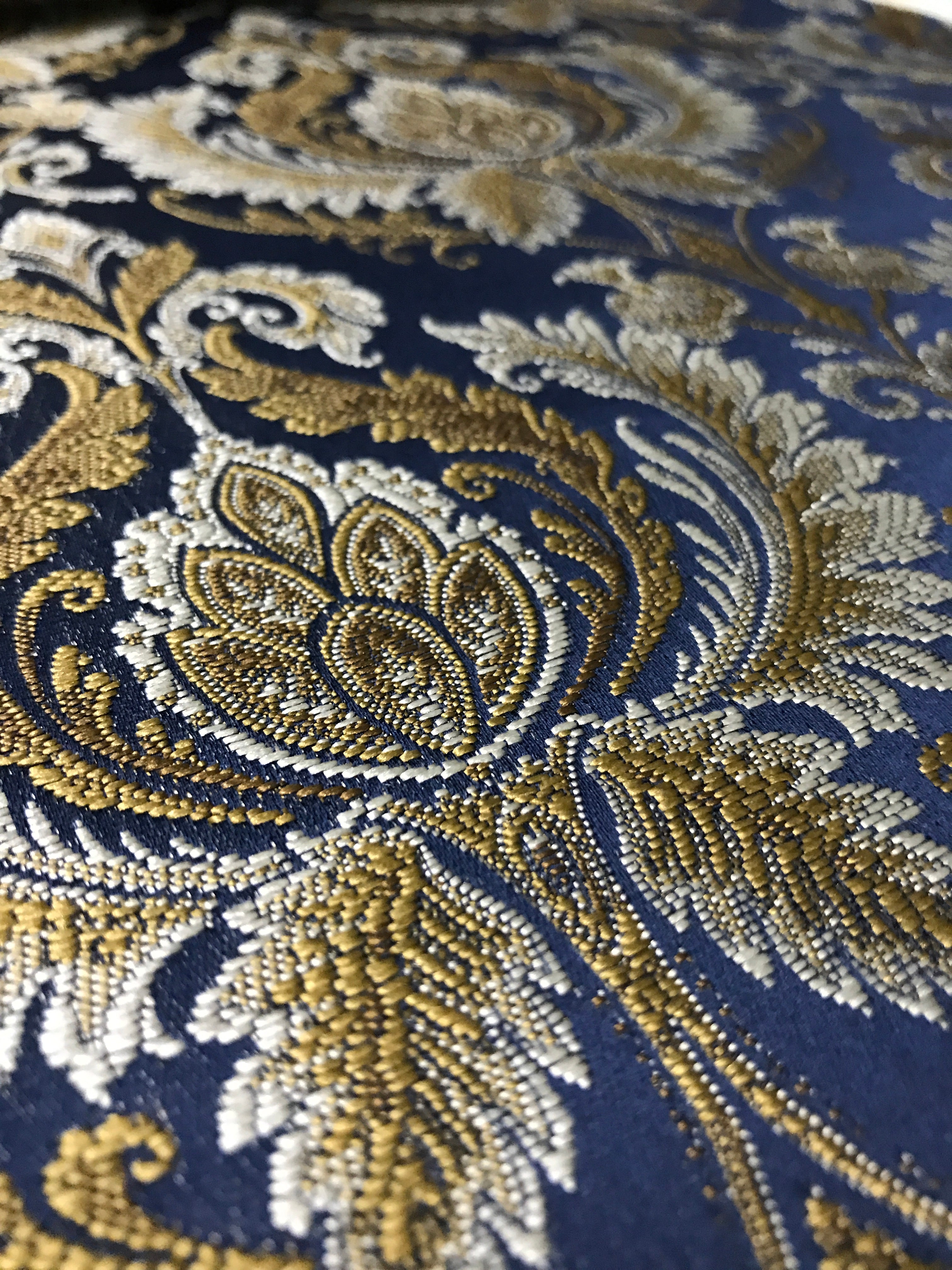 Navy damask fabric swatch showing repeat pattern detail