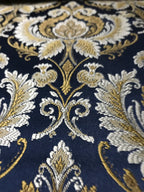 Navy damask fabric folded, texture and sheen close-up