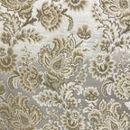 Patterned fabric with floral design in beige on a light Cream background