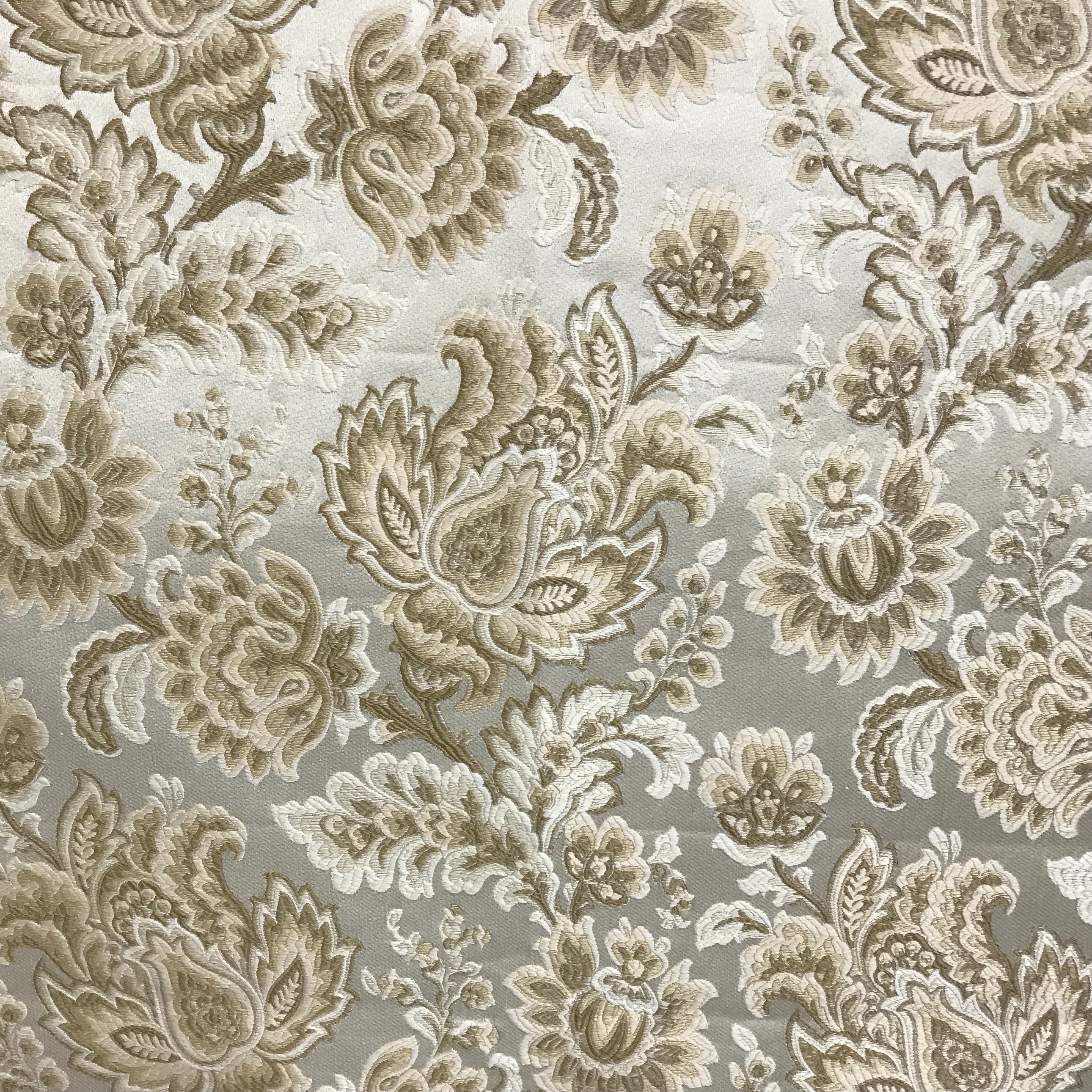 Patterned fabric with floral design in beige on a light Cream background