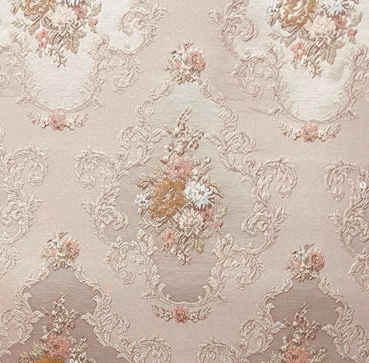 Decorative floral and leaf pattern on a light Peach background
