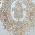 Close-up of damask ornate floral pattern on fabric with Cream color background