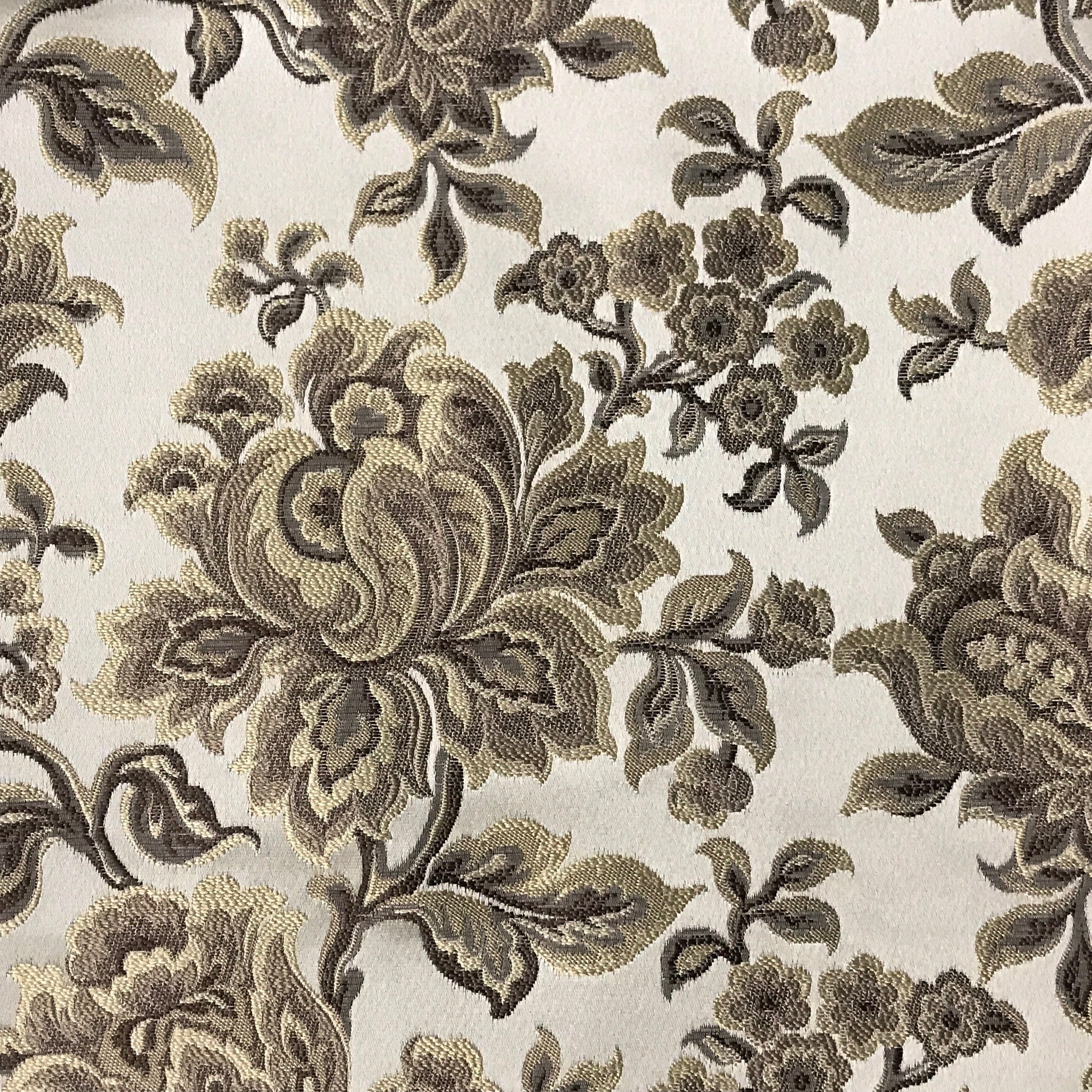 Taupe floral jacquard upholstery fabric by the yard, close-up pattern view.