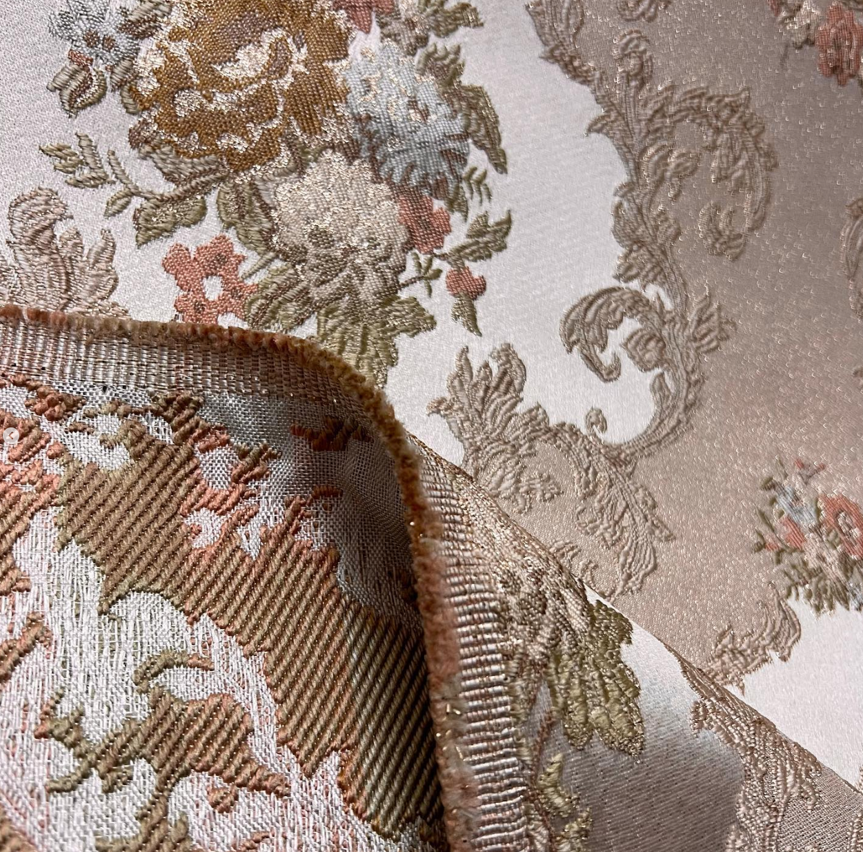 Decorative floral and leaf pattern on a light Peach background