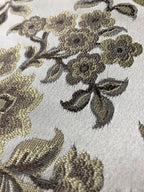 Taupe floral jacquard fabric swatch showing repeat pattern detail.