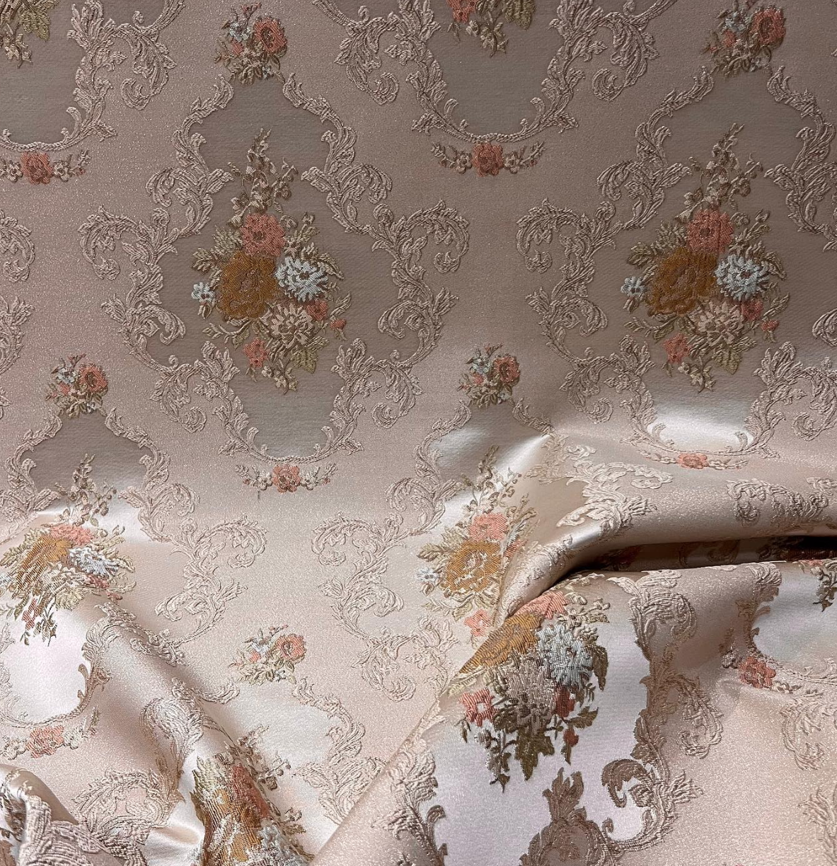 Decorative floral and leaf pattern on a light Peach background