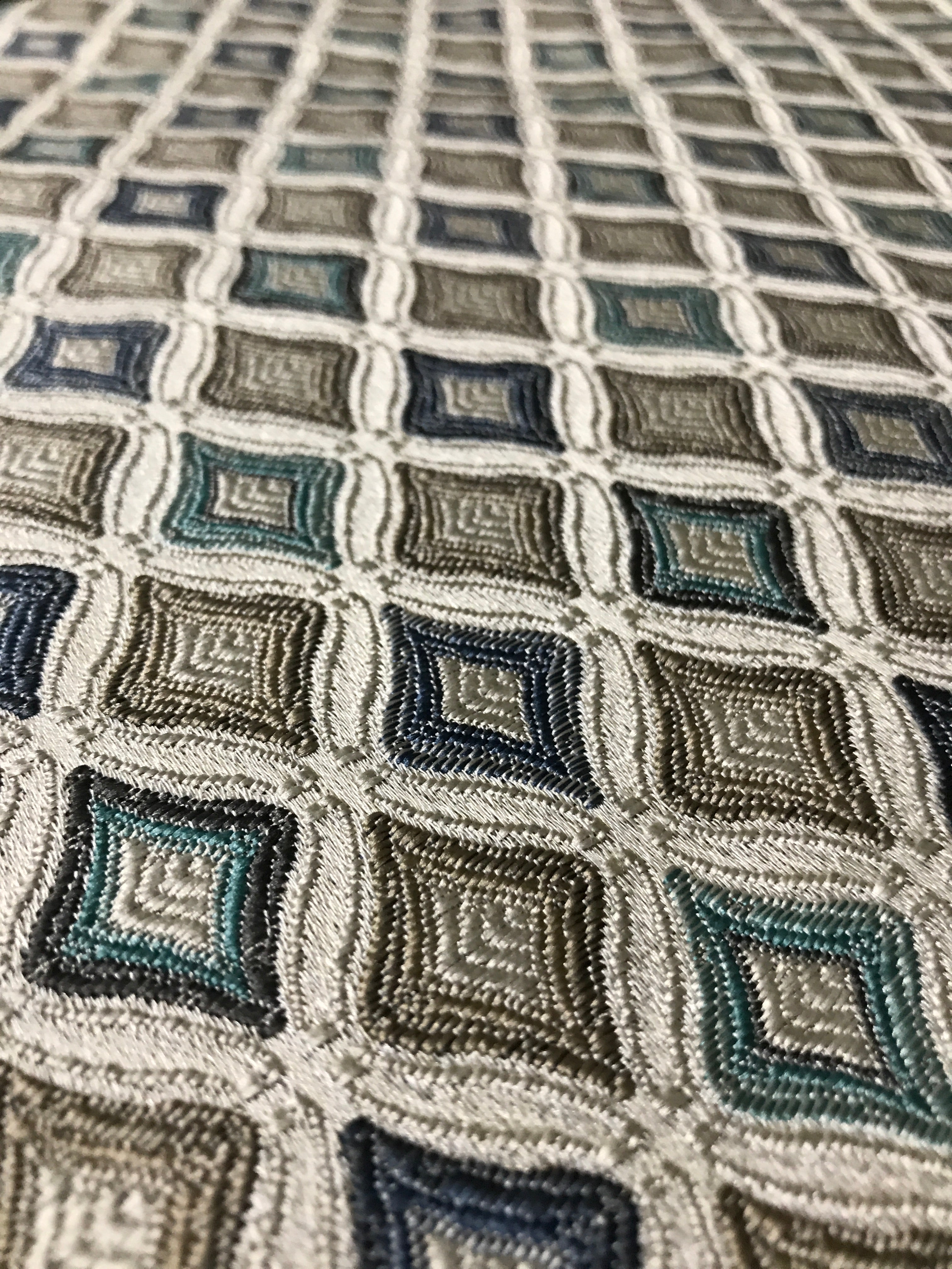 Close-up of a textured fabric with geometric pattern Teal Sage