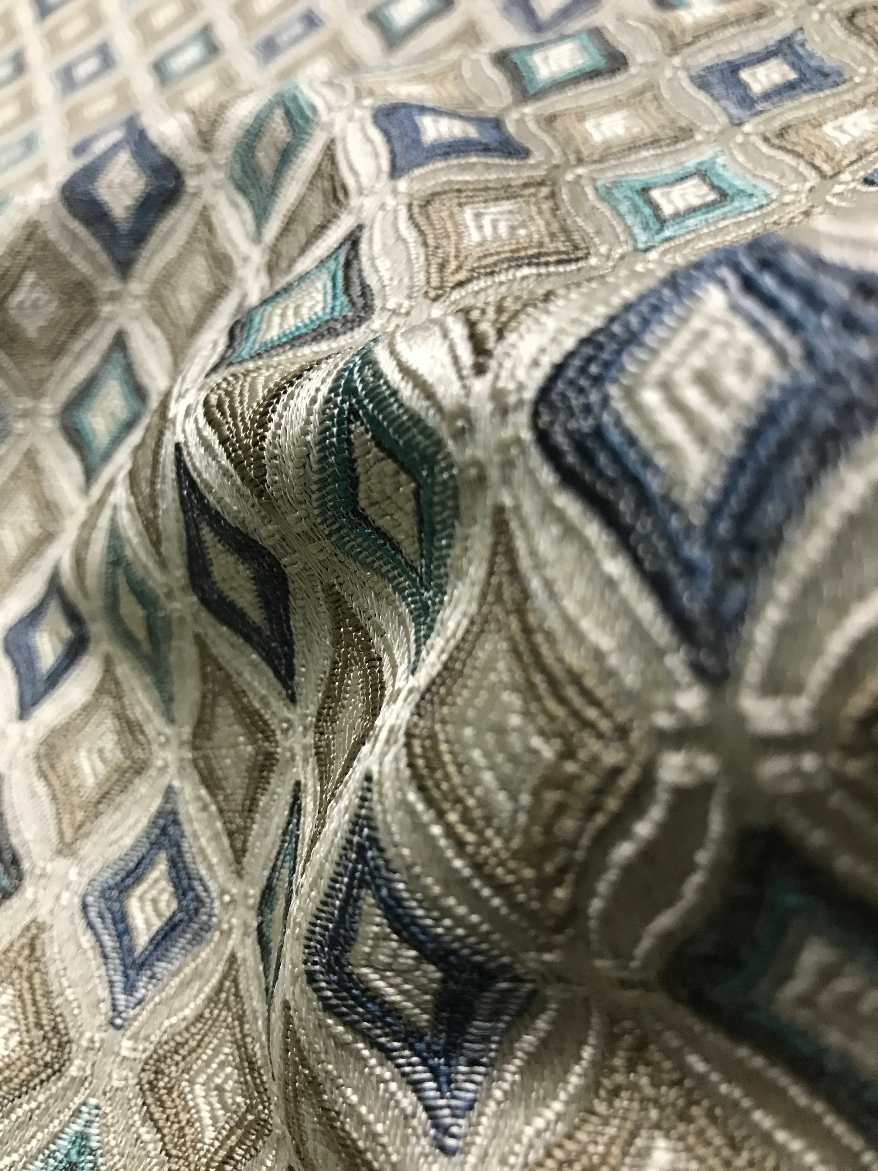 Close-up of patterned fabric with geometric design Teal Sage