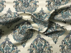 Decorative fabric with intricate paisley pattern in blue and gray on a beige background Teal Sage