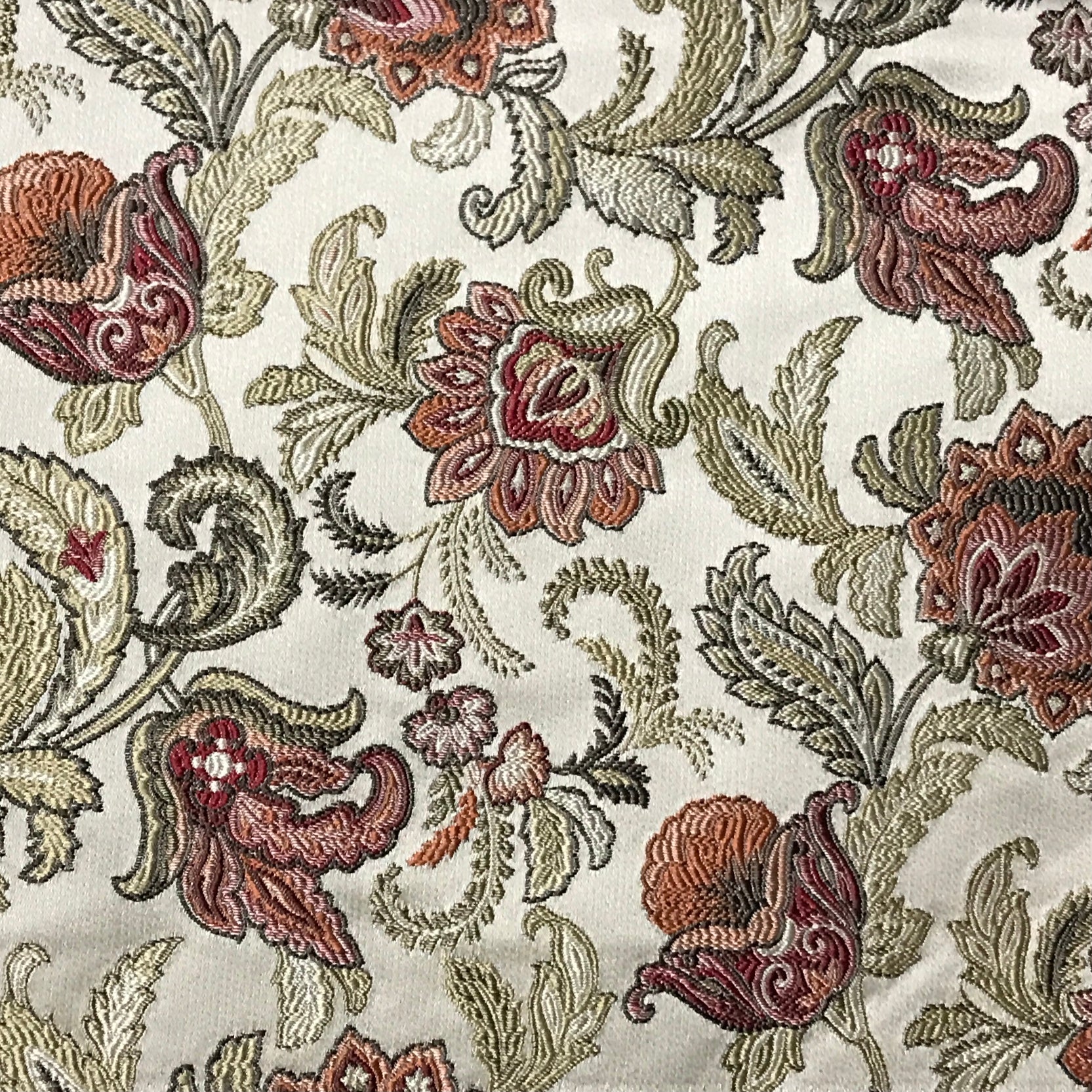 Close-up of floral embroidery pattern on fabric Sage Rose