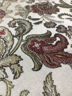 Close-up of intricate floral embroidery on fabric Sage Rose