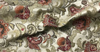 Close-up of floral patterned fabric with Sage Rose colors on a beige background