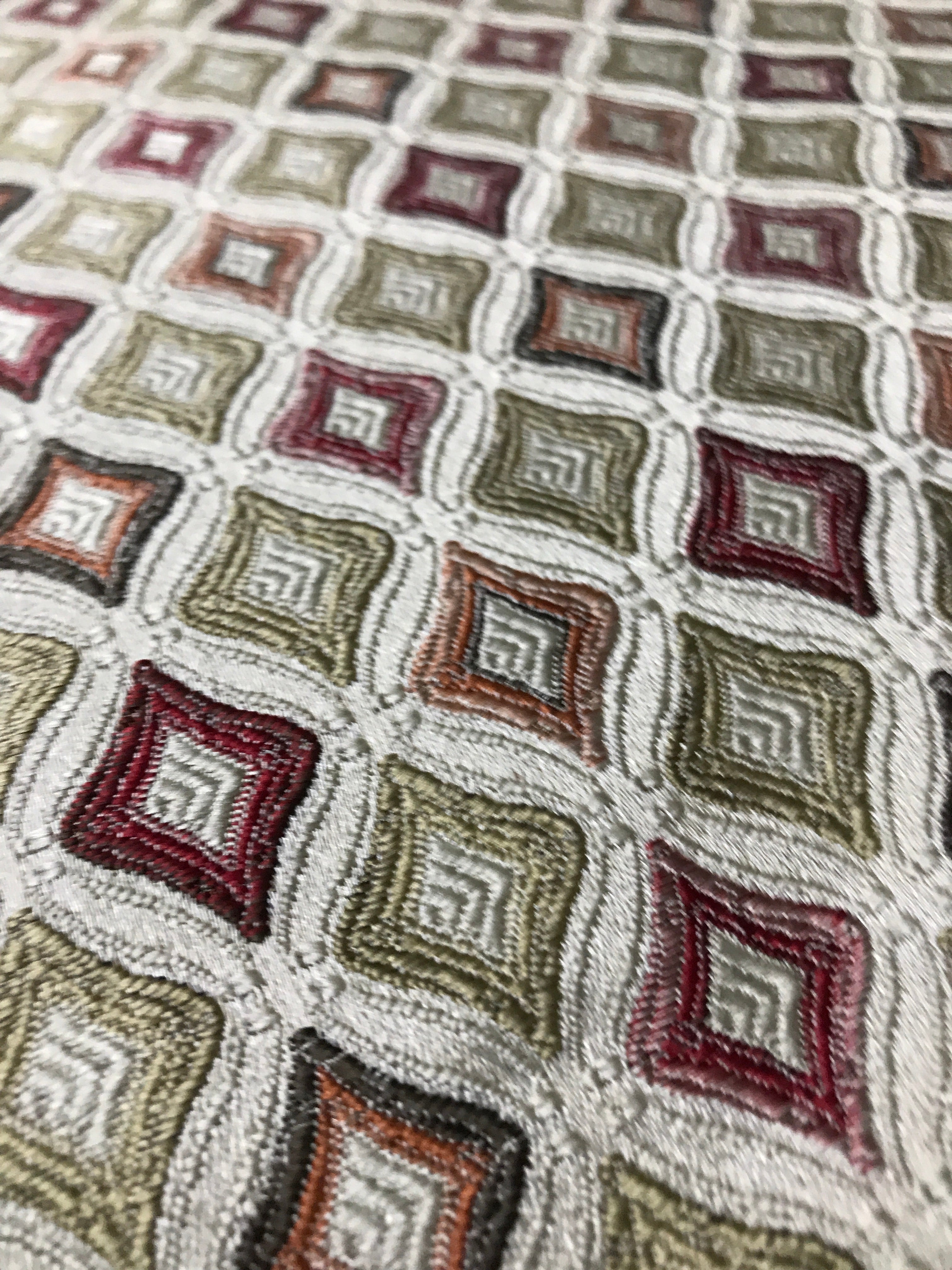 Close-up of a textured fabric with geometric pattern Sage Rose