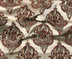 Decorative fabric with intricate paisley pattern on a beige background Sage Rose