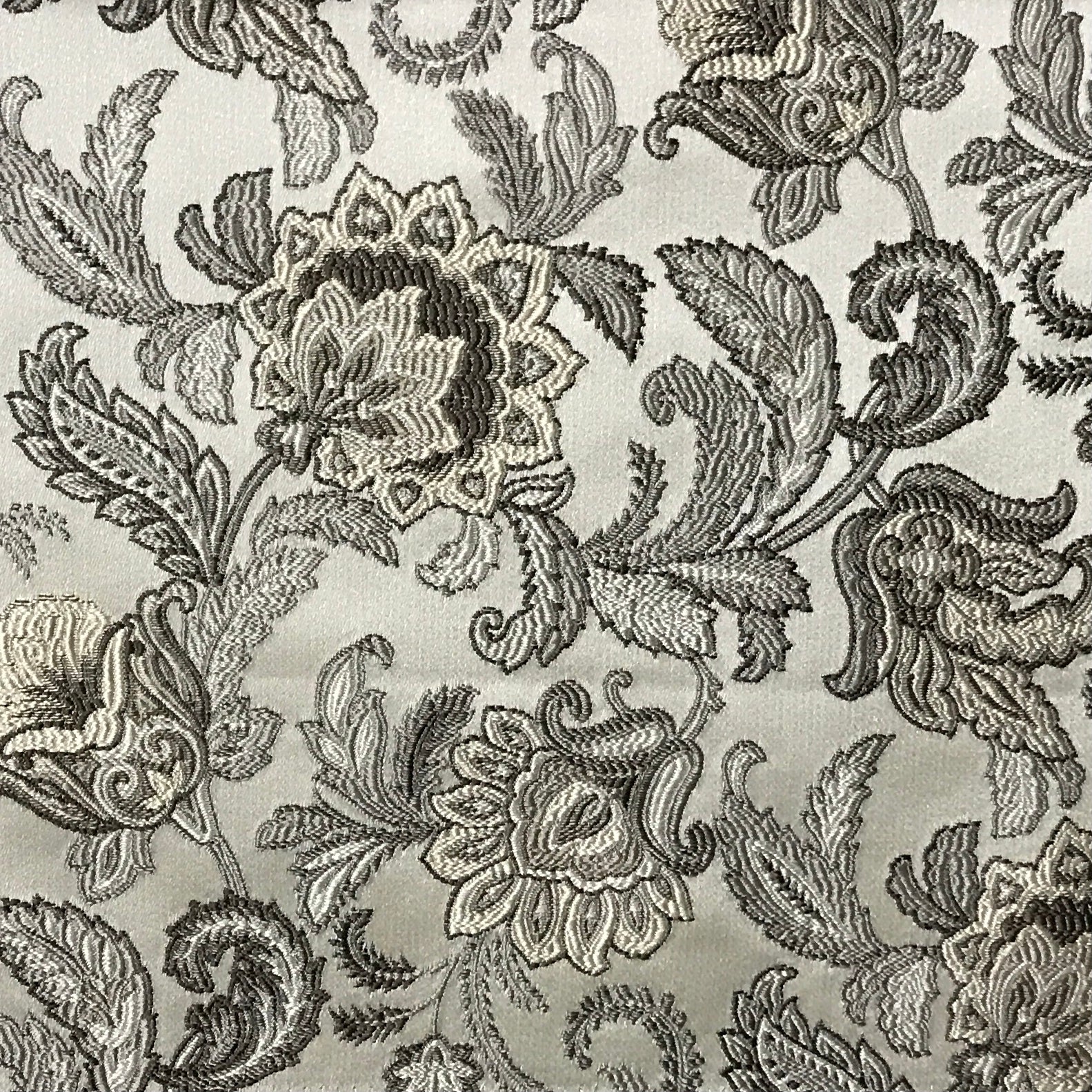Close-up of decorative floral pattern with black and gold on a beige background Stone Age
