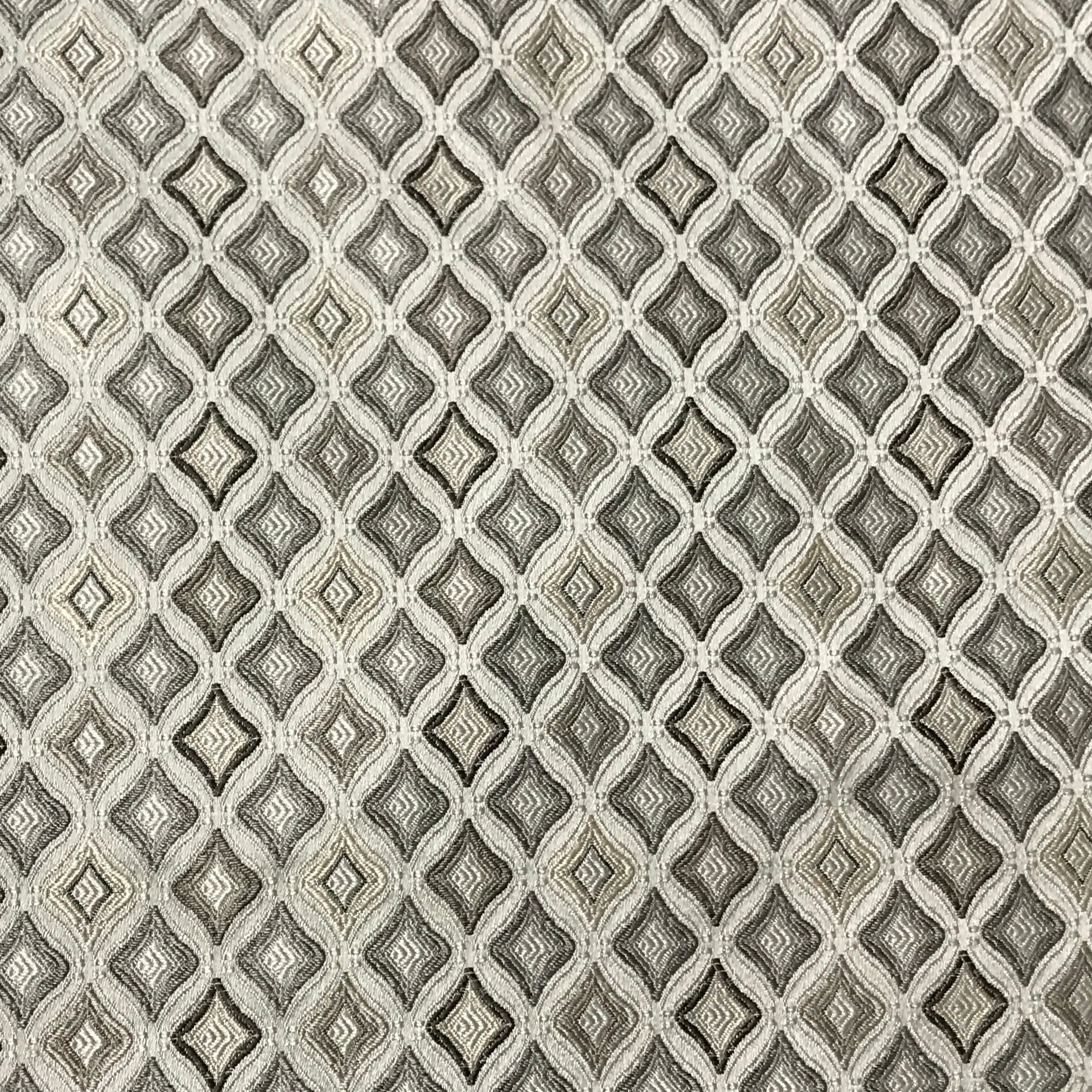 Patterned fabric with geometric design in blue, beige, and brown tones. Stone Age