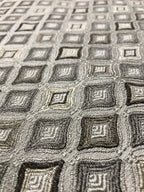 Close-up of a textured fabric with geometric pattern Stone Age