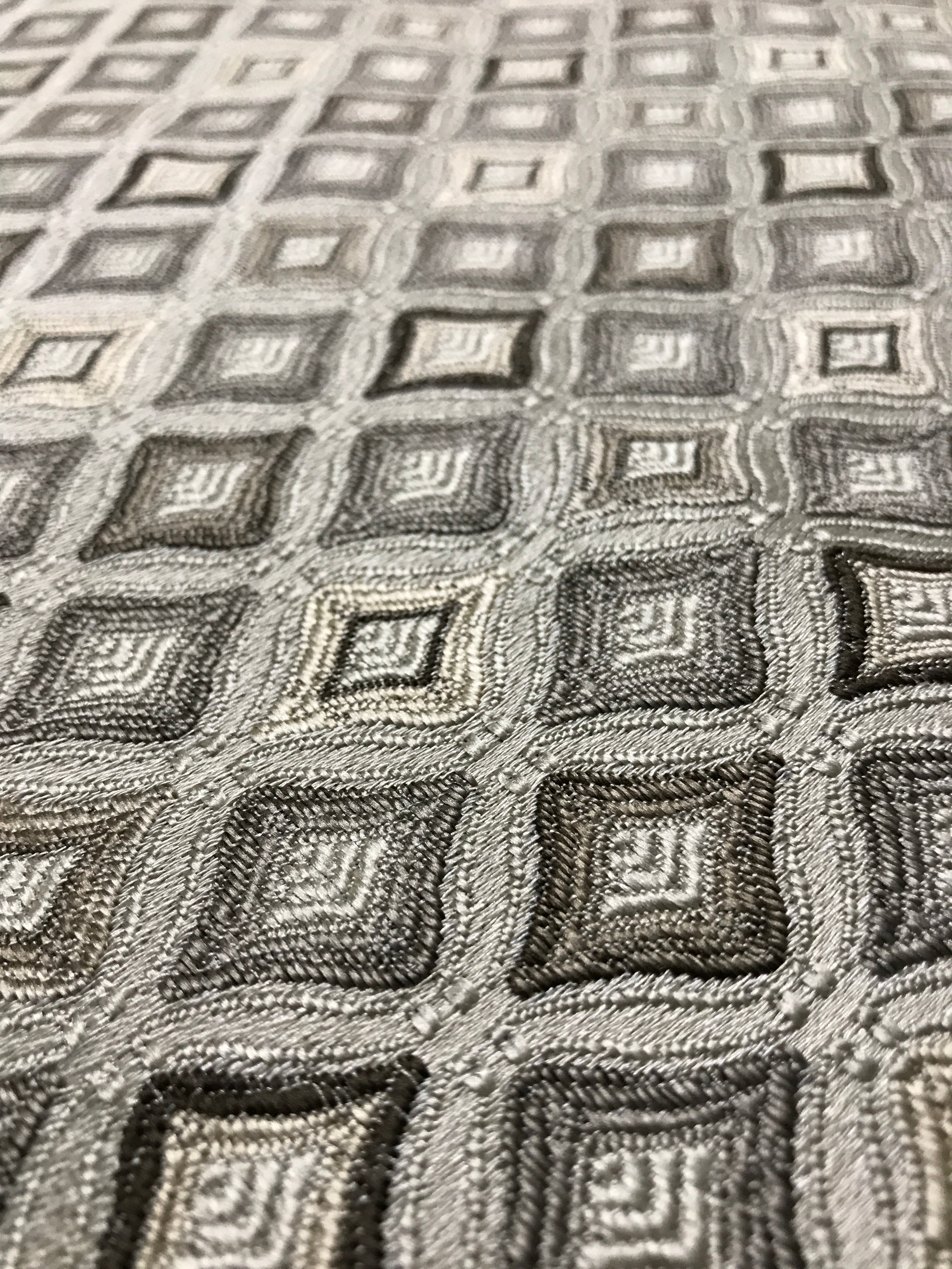 Close-up of a textured fabric with geometric pattern Stone Age